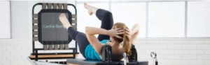 a woman performing Pilates exercises on Reformer with Trampoline